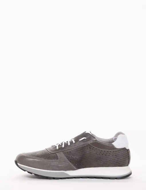 sneakers fondo in gomma e soletto interno in vera pelle. Tomaia in morbidissima pelle intrecciata con particolarissima suola ammortizzata grigio