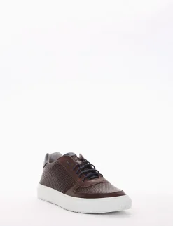sneakers fondo in gomma e soletto interno in vera pelle. Tomaia in morbidissima pelle nappata intrecciata con particolarissima foratura su entrambi i lati testa